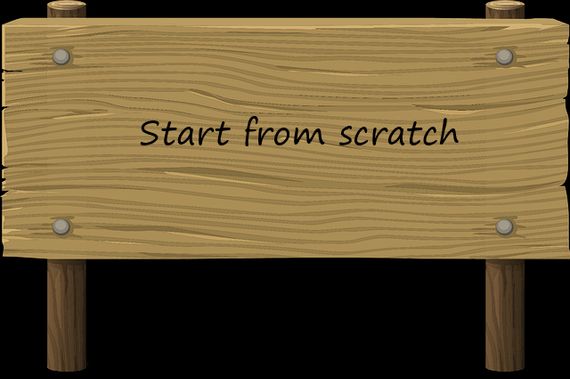 A wodden board with the text start from scratch.